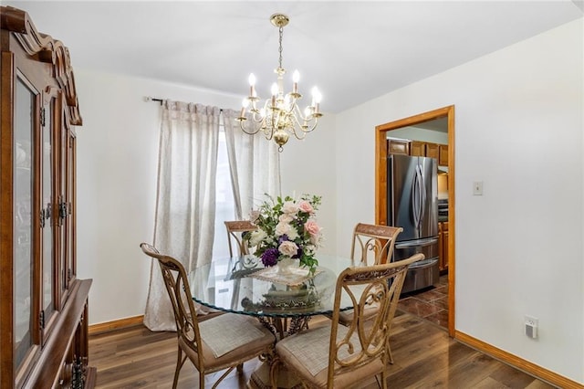 638 Colony Park Dr, La Place, LA 70068 - dining area with a chandelier and dark wood-type flooring