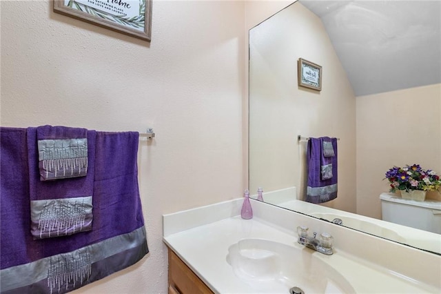 638 Colony Park Dr, La Place, LA 70068 - bathroom featuring vanity and lofted ceiling