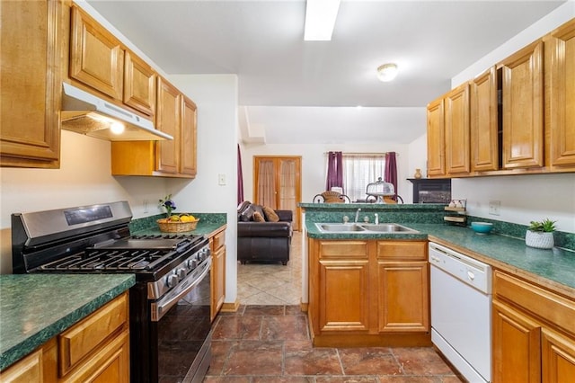 638 Colony Park Dr, La Place, LA 70068 - kitchen featuring stainless steel gas range oven, white dishwasher, under cabinet range hood, a peninsula, and dark countertops