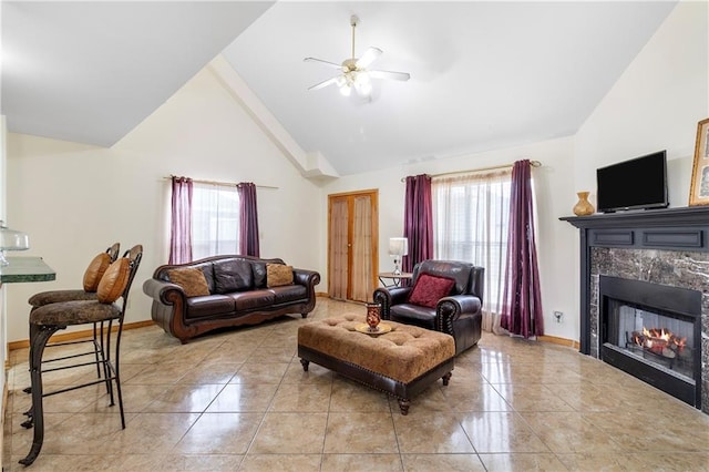638 Colony Park Dr, La Place, LA 70068 - living room with ceiling fan, light tile patterned flooring, a fireplace, and high vaulted ceiling