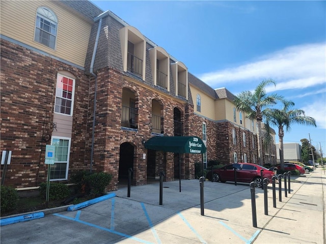 3320 N Arnoult Rd Unit 109, Metairie, LA 70002 - view of building exterior featuring uncovered parking