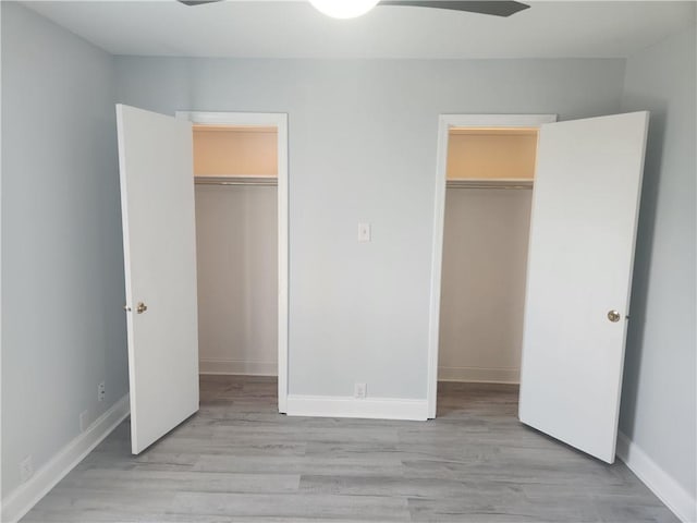 3320 N Arnoult Rd Unit 109, Metairie, LA 70002 - unfurnished bedroom featuring a spacious closet and light wood-type flooring