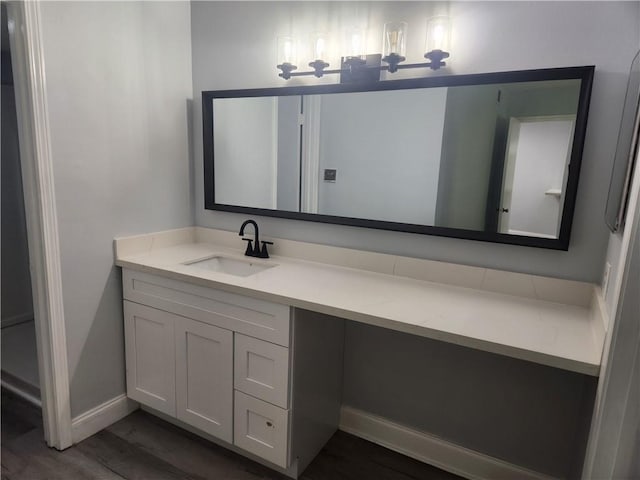 3320 N Arnoult Rd Unit 109, Metairie, LA 70002 - bathroom featuring wood finished floors and vanity