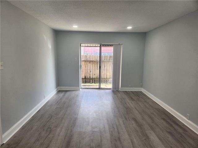 3320 N Arnoult Rd Unit 109, Metairie, LA 70002 - unfurnished room with dark wood-style floors, recessed lighting, and a textured ceiling