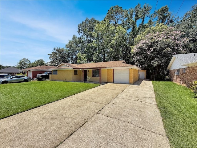 1593 Eastridge Dr, Slidell, LA 70458 - view of front of property with driveway, a garage, brick siding, and a front lawn