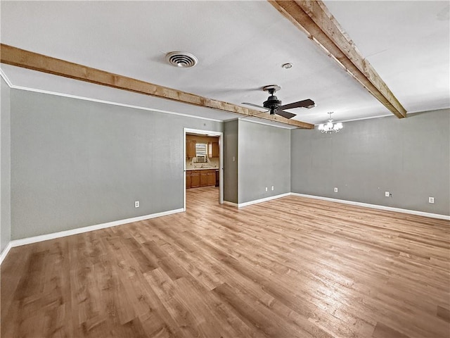 1593 Eastridge Dr, Slidell, LA 70458 - spare room featuring beamed ceiling, light wood finished floors, a ceiling fan, and a chandelier