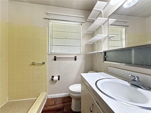 1593 Eastridge Dr, Slidell, LA 70458 - bathroom featuring vanity, wood finished floors, and a tile shower