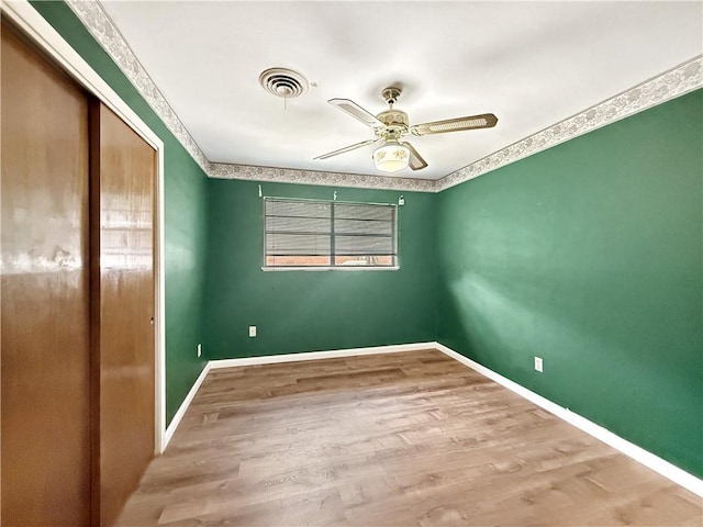1593 Eastridge Dr, Slidell, LA 70458 - empty room with ceiling fan and wood finished floors