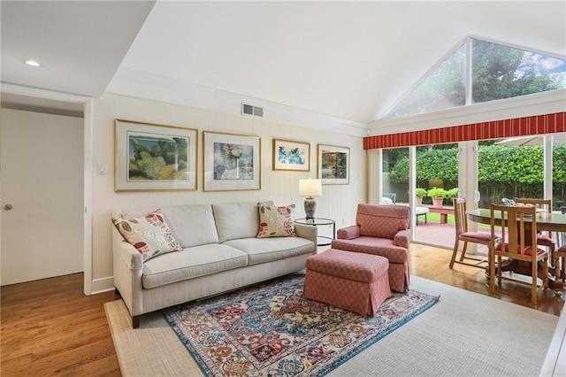 2310 Metairie Ct, Metairie, LA 70001 - living area with plenty of natural light, wood finished floors, and high vaulted ceiling