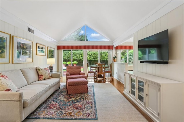 2310 Metairie Ct, Metairie, LA 70001 - living area with lofted ceiling, wood walls, and wood finished floors
