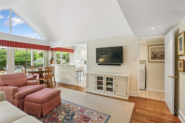 2310 Metairie Ct, Metairie, LA 70001 - living area featuring washer / dryer, wood finished floors, and lofted ceiling