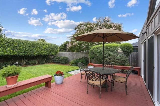 2310 Metairie Ct, Metairie, LA 70001 - wooden deck with a fenced backyard and outdoor dining space