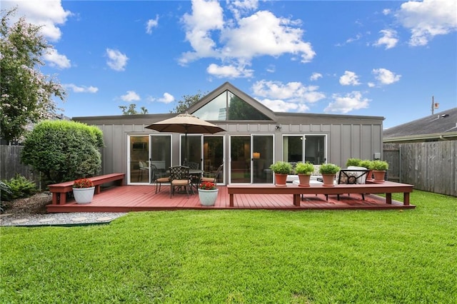 2310 Metairie Ct, Metairie, LA 70001 - back of house with board and batten siding and a deck