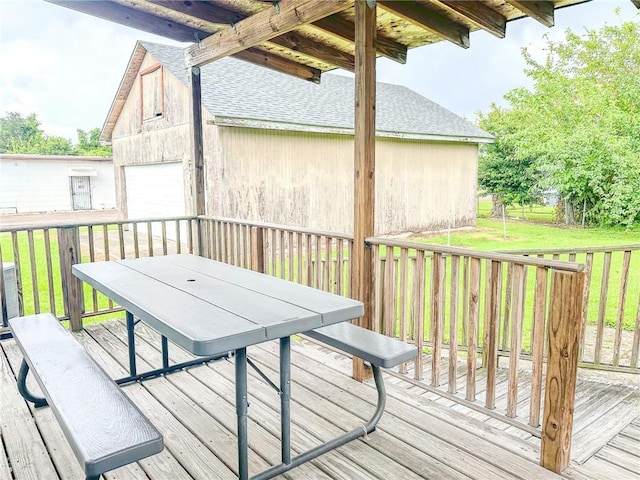 451 Sala Ave, Westwego, LA 70094 - wooden deck with outdoor dining area, a detached garage, and a yard