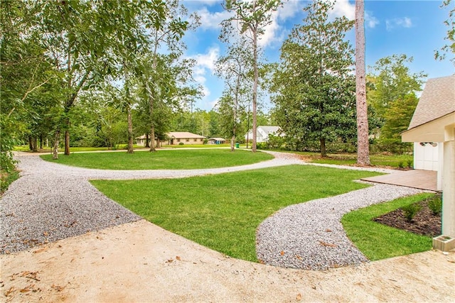 106 Woodlawn Ln, Mandeville, LA 70471 - view of home's community featuring a lawn and view of wooded area
