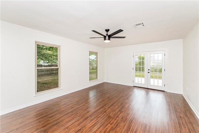 106 Woodlawn Ln, Mandeville, LA 70471 - unfurnished room featuring french doors, healthy amount of natural light, and dark wood-style flooring