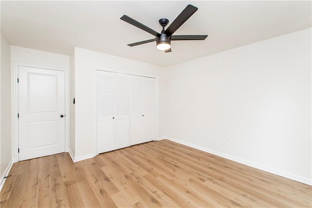 106 Woodlawn Ln, Mandeville, LA 70471 - unfurnished bedroom featuring light wood-style flooring, a closet, and ceiling fan