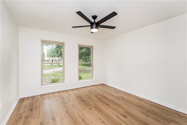 106 Woodlawn Ln, Mandeville, LA 70471 - spare room featuring wood finished floors and a ceiling fan