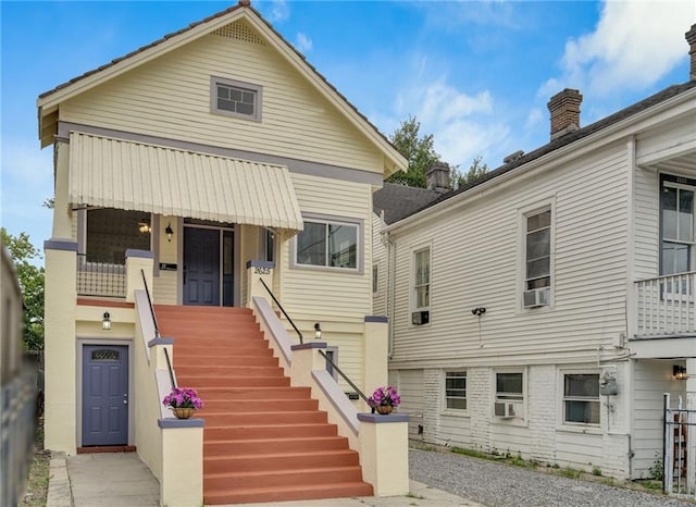 2625 Ursulines Ave, New Orleans, LA 70119 - back of property featuring cooling unit, stairway, and a chimney