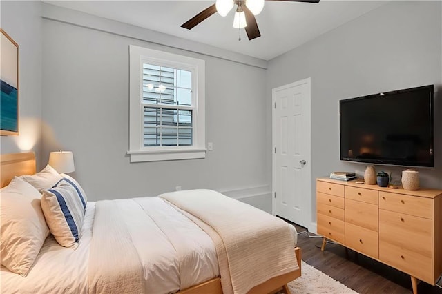 2625 Ursulines Ave, New Orleans, LA 70119 - bedroom with dark wood-style floors and a ceiling fan