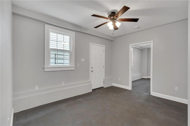 2625 Ursulines Ave, New Orleans, LA 70119 - spare room featuring concrete flooring and ceiling fan