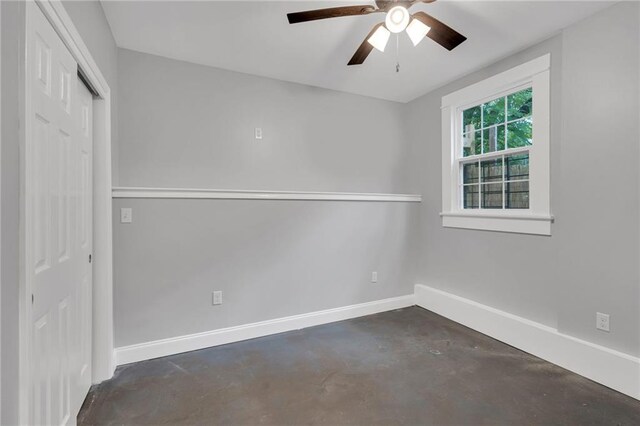 2625 Ursulines Ave, New Orleans, LA 70119 - unfurnished bedroom featuring concrete flooring, a closet, and ceiling fan