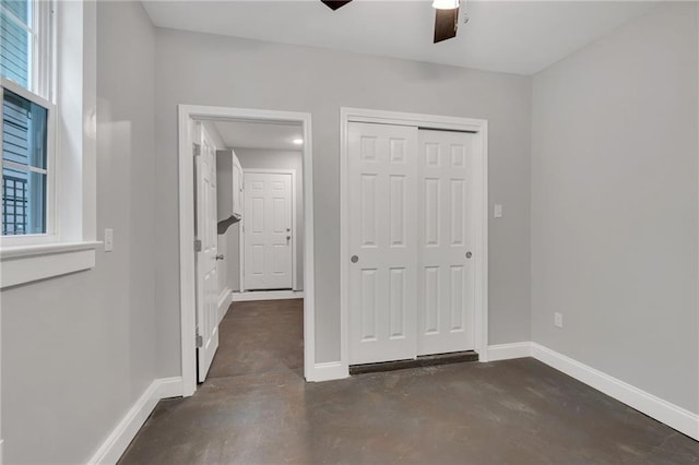 2625 Ursulines Ave, New Orleans, LA 70119 - unfurnished bedroom with concrete flooring, a closet, and ceiling fan
