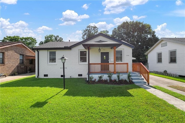 566 Gelpi Ave, Jefferson, LA 70121 - view of front of property featuring covered porch, crawl space, a front lawn, and brick siding