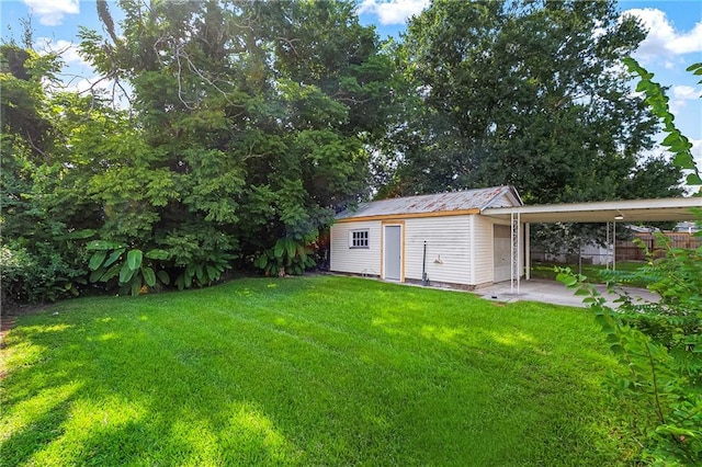566 Gelpi Ave, Jefferson, LA 70121 - view of yard with an outdoor structure and a carport