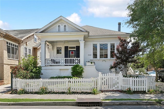5540 Pitt St, New Orleans, LA 70115 - view of front of house with covered porch and a fenced front yard