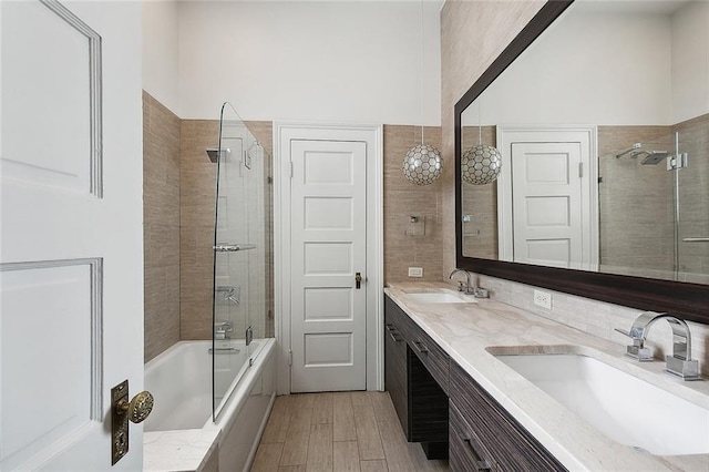 5540 Pitt St, New Orleans, LA 70115 - full bath with enclosed tub / shower combo, double vanity, and wood finished floors