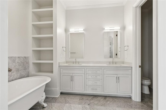 5540 Pitt St, New Orleans, LA 70115 - full bath featuring built in features, ornamental molding, marble look tiles, a freestanding bath, and double vanity