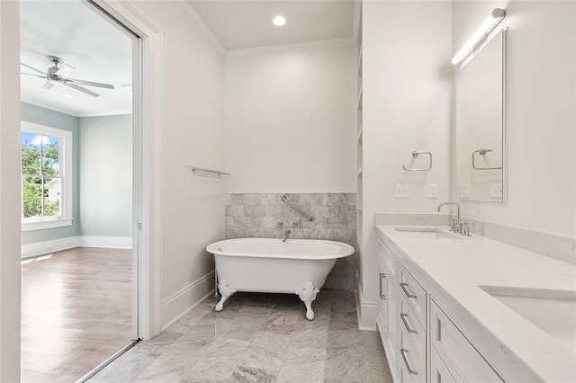 5540 Pitt St, New Orleans, LA 70115 - full bathroom with crown molding, a freestanding tub, double vanity, ceiling fan, and recessed lighting