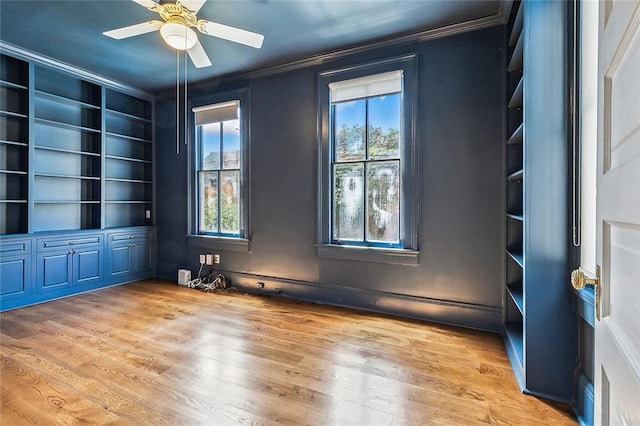 5540 Pitt St, New Orleans, LA 70115 - spare room with ornamental molding, light wood-style flooring, and ceiling fan