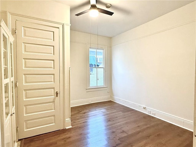 5540 Pitt St, New Orleans, LA 70115 - empty room with a ceiling fan and dark wood finished floors