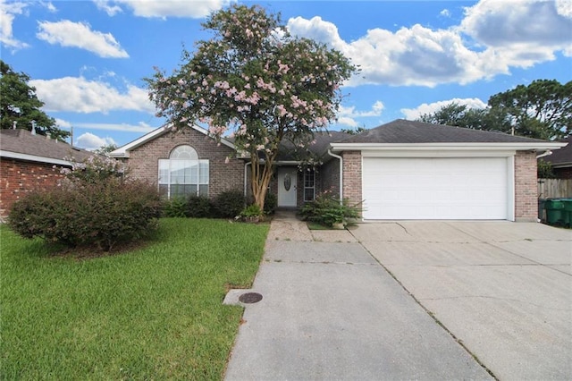 345 Sugarpine Dr, Gretna, LA 70056 - single story home with concrete driveway, brick siding, a front yard, and an attached garage