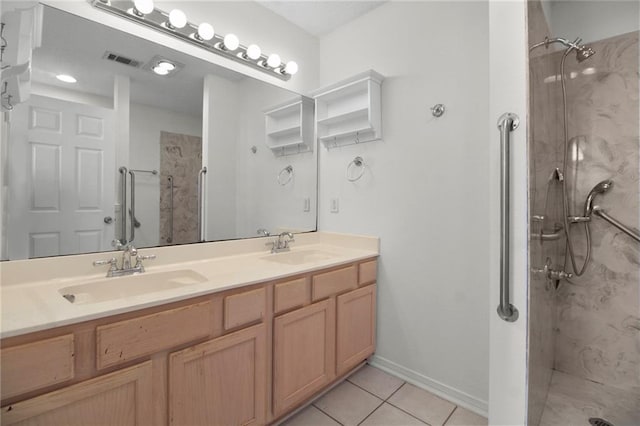 345 Sugarpine Dr, Gretna, LA 70056 - bathroom with a marble finish shower, double vanity, and tile patterned floors