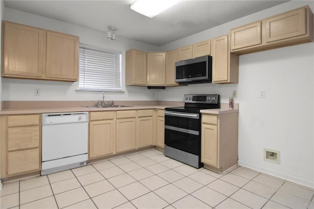 345 Sugarpine Dr, Gretna, LA 70056 - kitchen with appliances with stainless steel finishes, light brown cabinets, and light countertops