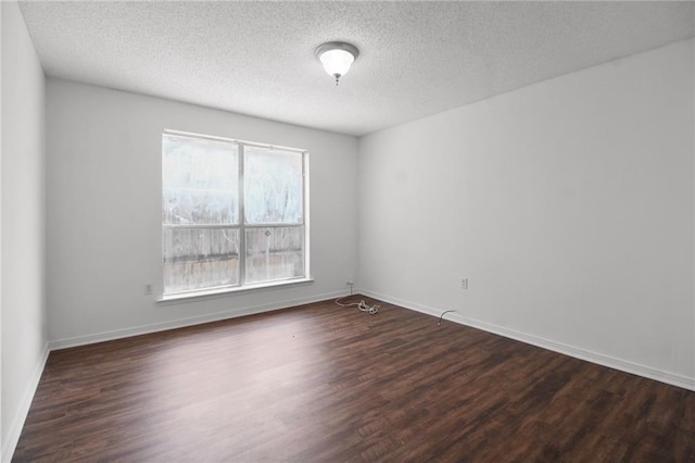 345 Sugarpine Dr, Gretna, LA 70056 - empty room with dark wood-style floors and a textured ceiling