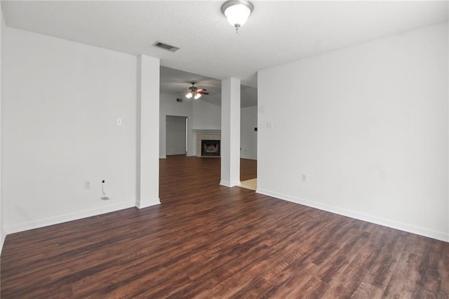 345 Sugarpine Dr, Gretna, LA 70056 - spare room with ceiling fan, dark wood-style floors, and a tile fireplace