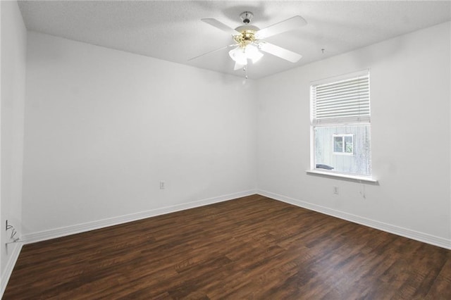 345 Sugarpine Dr, Gretna, LA 70056 - empty room with dark wood-type flooring, ceiling fan, and a textured ceiling