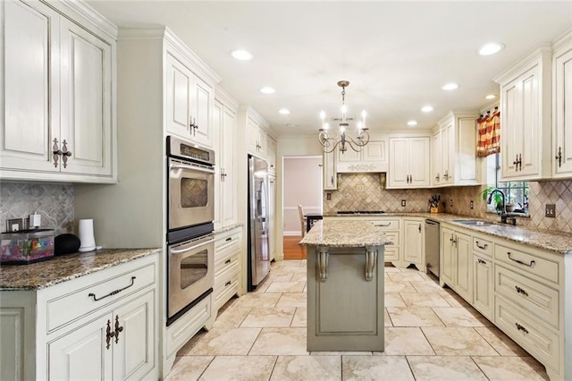 201 Shaunell Dr, Mandeville, LA 70448 - kitchen featuring stainless steel appliances, decorative backsplash, a chandelier, light stone counters, and recessed lighting