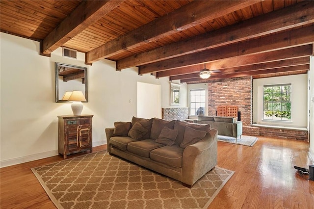201 Shaunell Dr, Mandeville, LA 70448 - living room with a wood ceiling with exposed beams, wood finished floors, ceiling fan, and a fireplace