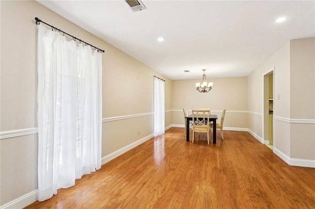 201 Shaunell Dr, Mandeville, LA 70448 - unfurnished dining area with a chandelier, light wood-style floors, and recessed lighting