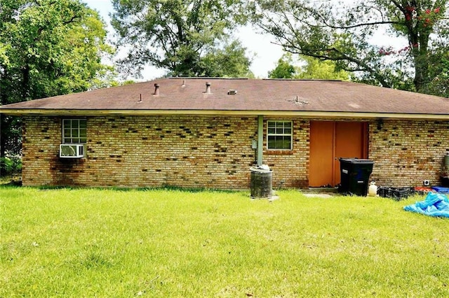 110 E Green St, Hammond, LA 70403 - back of house with a lawn, brick siding, and roof with shingles