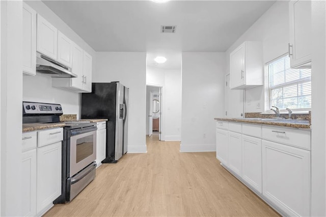 6501 Selma St, New Orleans, LA 70126 - kitchen featuring stainless steel appliances, under cabinet range hood, light wood finished floors, white cabinets, and stone countertops