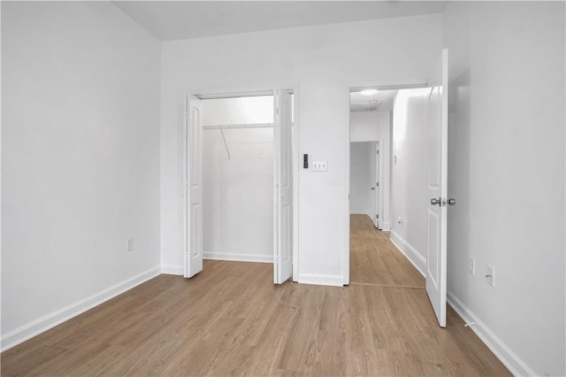 6501 Selma St, New Orleans, LA 70126 - unfurnished bedroom with light wood finished floors and a closet