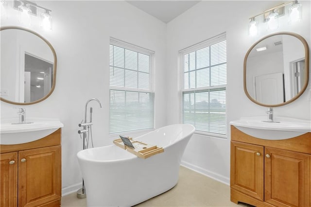 6501 Selma St, New Orleans, LA 70126 - full bath with two vanities and a freestanding tub