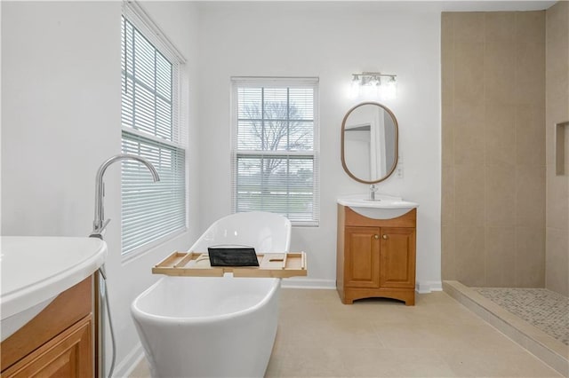6501 Selma St, New Orleans, LA 70126 - bathroom with vanity, a freestanding bath, and a tile shower