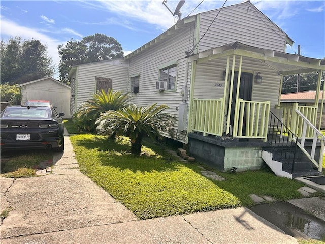 4040 Velie St, New Orleans, LA 70126 - view of front of house with a front lawn